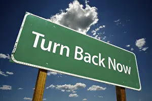 Dramatic Road Sign Prints: Turn back now road sign with dramatic clouds and sky