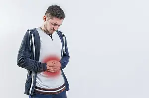 Digestive Problems Prints: Unhappy man with digestive problems isolated