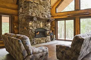 Log Cabin Interior Photography Prints: Upholstered sofas with lit fieldstone