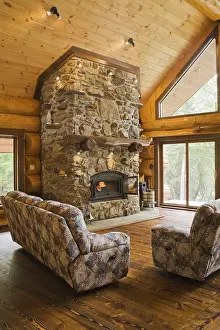 Log Cabin Interior Prints: Upholstered sofas with lit fieldstone