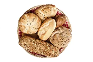 Freshly Baked Bread Prints: Various kinds of bread in basket over white background