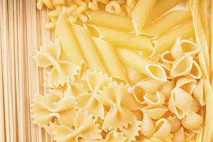 Culinary Background Prints: Various pasta types as a background on the table