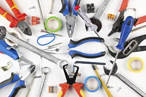 White Background Tools Prints: Various tools and materials scattered on white background