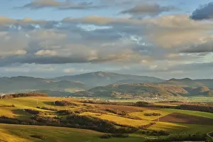 Central European Countryside Views Prints: Vegetation of forests and fields in the hills with clouds in evening light