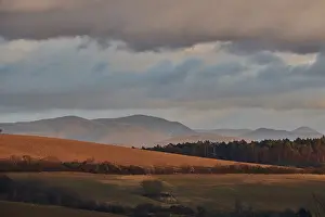 Europe Countryside Scenery Prints: Vegetation of forests and fields in the hills with clouds in evening light