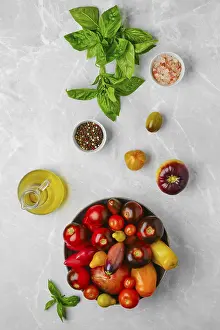 High Angle View Of Tomatoes Prints: Vertical composition with various types of tomatoes