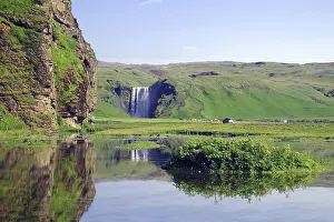Northern Europe Waterfalls Prints: Vertically falling waterfall reflected in the water