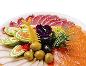 Edible Fish Dishes Prints: A vibrant platter displays an array of sashimi