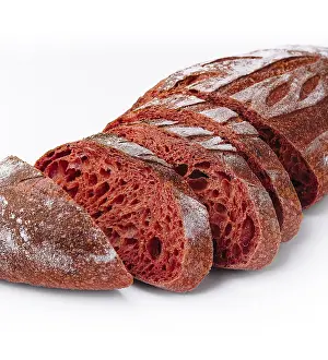 Colorful Baked Goods Prints: Vibrant sliced loaf of beetroot bread isolated on a white background
