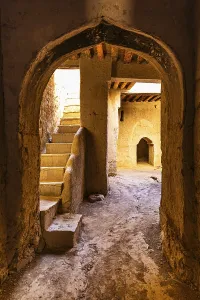Oman Mud Town Prints: View into an arched vault with staircase