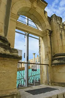 Prints of View through former arched window of ruins of former opera house Royal Opera House of Valletta destroyed in World War II on seating of integrated open-air stage, Valletta, Malta Opera Prints: Valletta Royal Opera House WWII Print
