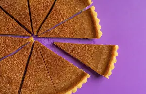 Pumpkin Pie Prints: Above view of a cut pumpkin pie with a slice separated