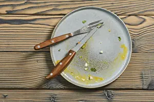 Deserted Breakfast Table Prints: Top view of empty dirty plate on a table
