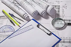 Real Estate Market Prints: View on drawing tools with blueprints