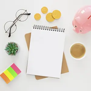 Empty Notepad Prints: Top view financial elements arrangement with empty notepad