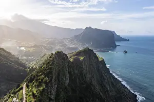 Uninhabited Rocky Shoreline Prints: View of forest-clad cliffs and mountains