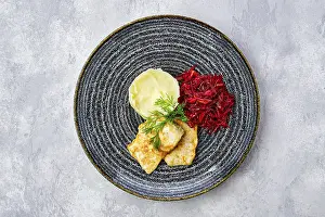 Seafood Meal Prints: Top view of fried hake in breading with mashed potato and roasted beetroot