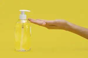 Cleanliness In Kitchen Prints: Side view hand using liquid soap