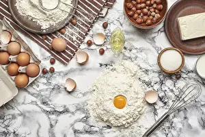 Marble Table Background Prints: Top view of a kitchenware and baking ingredients on a marble table background
