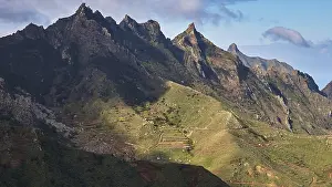 Mountainous Landscape Prints: View of a mountain range under partly cloudy sky