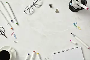 Home Office Organization Prints: Top view of an organized creative workspace setup featuring a sketchbook