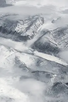 Snow Covered Mountain Range Prints: View from the plane on glacier