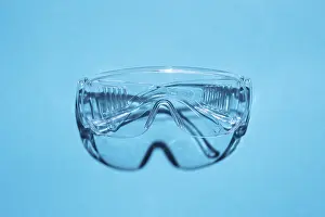 Deserted Blue Background Image Prints: Top view of plastic goggles against a blue background