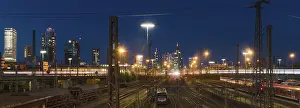 Central Europe Cityscape Photography Prints: View over rails and moving train to the main station