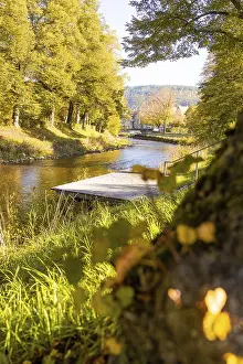 Autumn River View Prints: View across the river onto a jetty