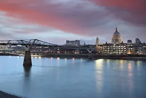 British Tourist Attraction Images Prints: A view across the River Thames at dusk towards St