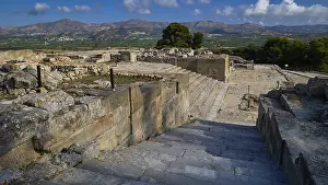 Greek Island Landscapes Prints: View of ruins from elevated position with mountains behind them