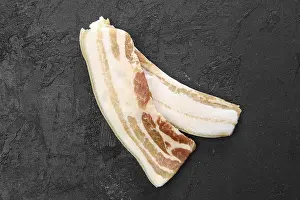Close Up Bacon Prints: Top view of two slices of bacon on the table