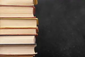 Book Stack Prints: Front view stack different books with copy space