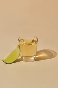 High Angle View Of Drink Prints: View from above on tequila shot with slice of lime