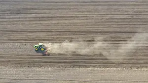Field Work And Cultivation Prints: Above view of tractor as pulling machine