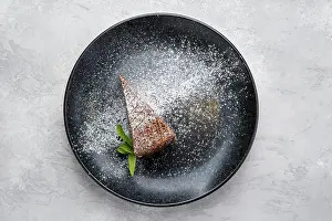 Bakery Products Photography Prints: Top view of triangular piece of chocolate cake on a plate
