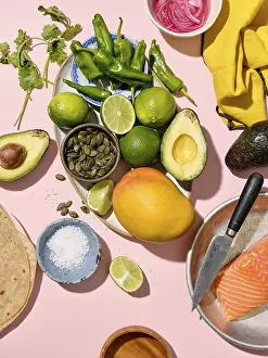 Vibrant Food Photography Prints: Top view of a vibrant array of taco ingredients spread on a pink backdrop