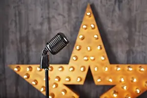 Empty Studio Environment Picture Prints: Vintage microphone in studio with star on background