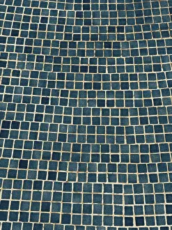 Geometric Mosaic Pattern Prints: A visually captivating abstract image of a blue tiled wall