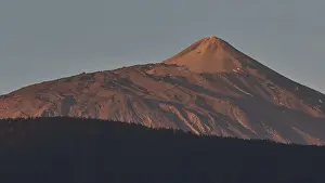 Evening Sun In Africa Prints: Volcano at sunset, pink light on the summit