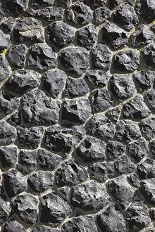 Deserted Rock Structure Prints: Detail of a wall of black, irregular rocks