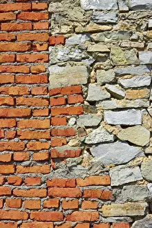 Deserted Countryside Scene Prints: Wall partially from formless stone and red brick