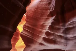 Arizona Desert Landscape Photography Prints: Warm rays of sunlight illuminate the undulating structures inside a rock cave