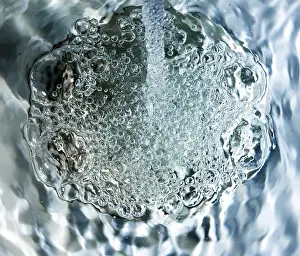 Empty Waterfront Scene Prints: Water flows into a sink