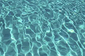 Deserted Pool Scene Prints: Water in pool with sun reflection