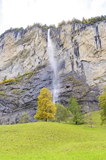 Bernese Oberland Scenery Prints: A waterfall flows down from high rocks