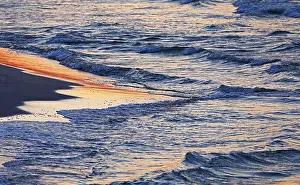 Evening Atmosphere On The Coast Prints: Waves on the beach in the evening light