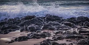 Deserted Coast Prints: Waves roll onto the beach