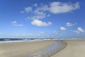 Sandy Beach Germany Prints: Waves running out at the sandy beach