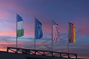 Deserted Evening Atmosphere Europe Prints: Waving flags in the evening sky
